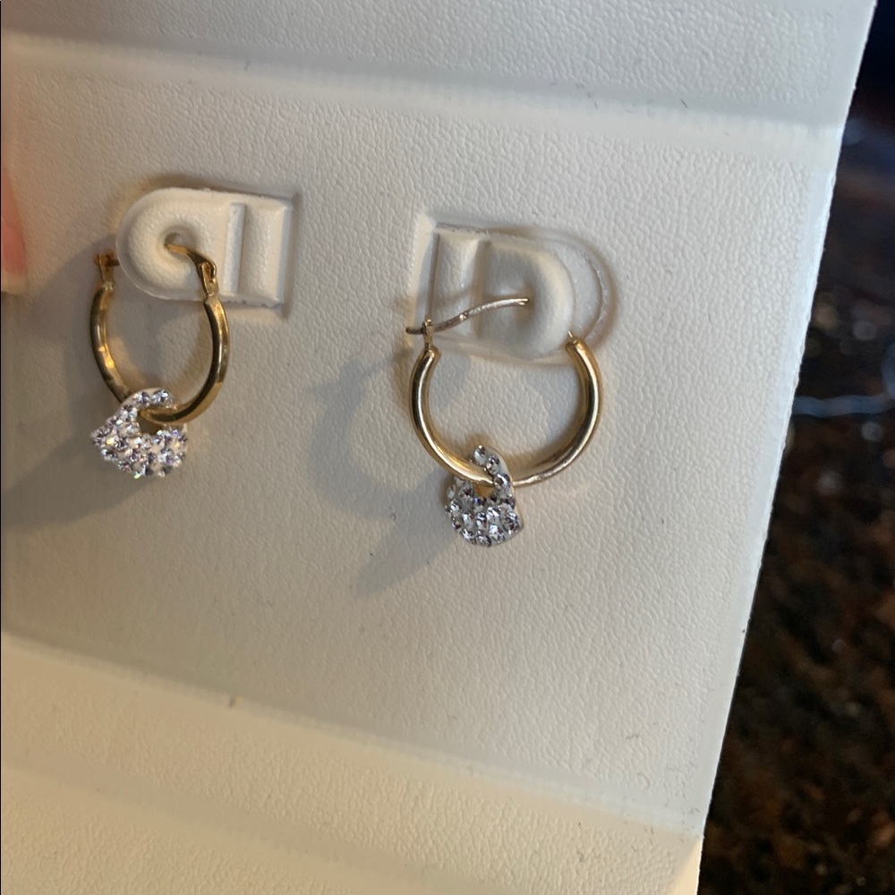 Gold hoop earrings with crystal blingheart charm.